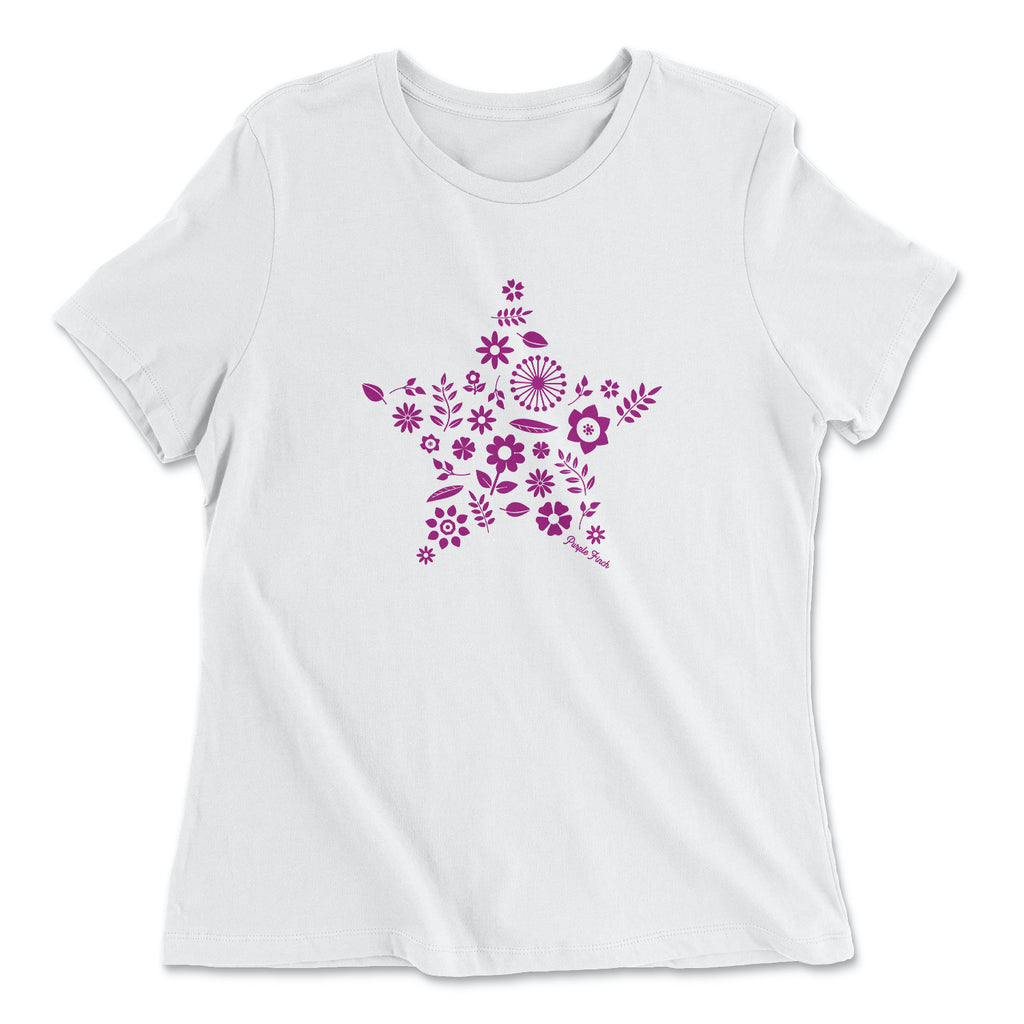 This white t-shirt has a magenta graphic print of a number of flowers and leaves grouped together into the shape of a star.  