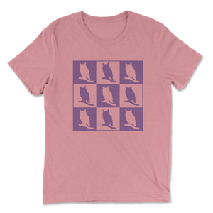 The image on this t-shirt has nine squares, three per row, of alternating purple and pink owls. The pink owl has a purple background, and the purple owl is in front of a pink background.